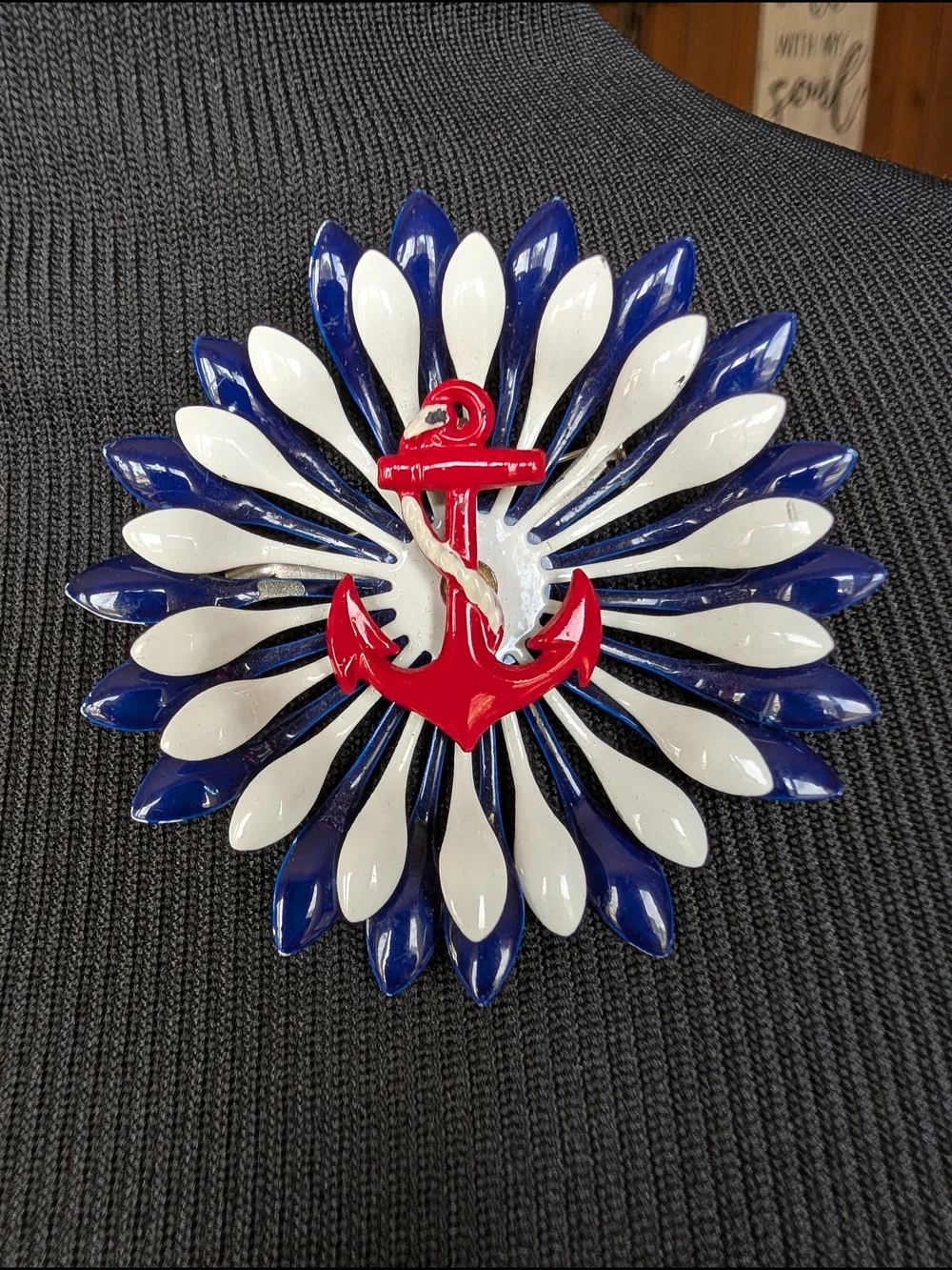 Nautical Red Anchor Brooch with Blue and White Petal Design